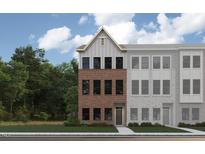 New townhome features a brick facade with a front door and a manicured lawn at 685 Bandon Aly, Cary, NC 27513