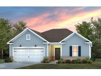 Charming single-story home featuring a two-car garage, well-manicured lawn, and craftsman-style details under a colorful sky at 740 Ben Ledi Ct, Raleigh, NC 27603