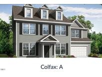 Charming two-story home with gray siding, black shutters, dormer windows, and an attached garage at 000 Olivia Pope Way, Efland, NC 27243