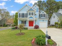 Charming two-story home with a well-manicured lawn and inviting curb appeal at 101 Rustic Pine Ct, Apex, NC 27502