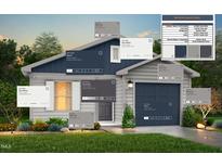 Beautiful home featuring navy blue and white color scheme with a 2 car garage and well-maintained landscaping at 224 Landon Pl, Roxboro, NC 27573