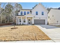 Charming two-story home featuring a modern design, well-manicured lawn, and attached garage at 3297 Oakfields Rd # 1, New Hill, NC 27562