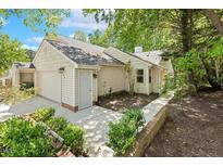 Charming home featuring a garage, manicured landscaping and neutral siding at 108 Woodglen Dr, Cary, NC 27518