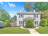Charming two-story home featuring a well-manicured lawn and traditional architectural details at 121 Drumbuie Pl, Garner, NC 27529