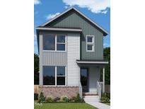 Charming two-story home with a stylish gray exterior, a brick foundation, and a welcoming front porch at 14 Relaxing Way, Pittsboro, NC 27312