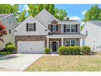 Beautiful home featuring a combination of stone, shingles, and siding at 3411 Massey Pond Trl, Raleigh, NC 27616