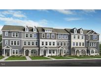 New townhome construction featuring varying gray and white exterior paint schemes at 418 Rowe Way, Knightdale, NC 27545