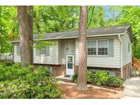 Charming home showcasing well-kept landscaping and a welcoming entrance at 1209 Shincliffe Ct, Cary, NC 27511