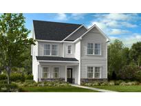 Charming two-story home with stone accents and a covered front porch provides an inviting curb appeal at 1268 Hardin Hill Ln, Knightdale, NC 27545