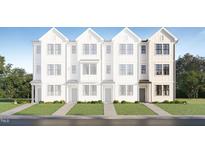New townhouse construction with a white exterior, lawn, and sidewalk leading to the entrance at 1533 Crescent Townes Way, Raleigh, NC 27604