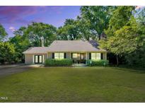 Charming single-story home with a well-manicured front yard and inviting entrance at 704 N Orange Ave, Dunn, NC 28334