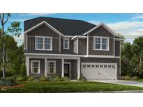 Charming two-story home featuring gray siding, white trim, and a well-maintained lawn at 921 Kinglet House Rd, Knightdale, NC 27545