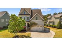 Charming two-story home with a two-car garage and mature landscaping at 3832 Crimson Clover Ave, Wake Forest, NC 27587