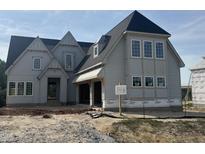 Under construction, new traditional two-story home showcasing craftsman-style details and large windows at 1021 Azalea Garden Cir, Raleigh, NC 27603