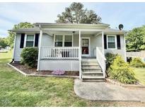 Charming home with covered porch, front lawn, and easy access with minimal stairs at 309 19Th St, Butner, NC 27509