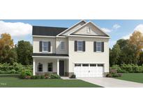 Charming two-story home with neutral siding, black shutters and a two car garage at 1316 Rose Gold Ln, Raleigh, NC 27610