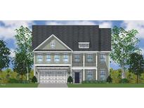 Charming two-story home boasts a symmetrical facade and well-maintained landscaping at 3019 Dog Rose Dr # 168, Durham, NC 27703