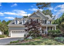Charming two-story home features a manicured front yard and attached two-car garage at 733 Hadrian Dr, Garner, NC 27529
