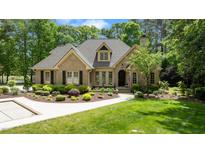 Charming brick home with manicured landscaping and inviting front entrance at 116 Hibiscus Dr, Clayton, NC 27527