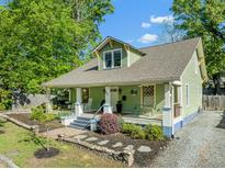 Charming craftsman home with a welcoming front porch and beautifully landscaped yard at 501 Mallard Ave, Durham, NC 27701