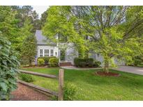 Charming two-story home with beautiful landscaping and a split rail fence at 1311 Antler Point Dr, Durham, NC 27713