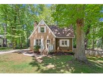 Charming brick and wood home featuring a cozy front yard and inviting entrance at 224 Heidinger Dr, Cary, NC 27511