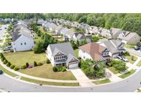 Scenic aerial view of a neighborhood featuring well-maintained homes and green spaces at 2437 Everstone Rd, Wake Forest, NC 27587