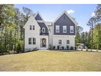Beautiful two-story home with a brick and siding exterior, landscaped yard, and welcoming front porch at 8237 Baronleigh Ln, Wake Forest, NC 27587