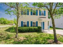 Charming two-story home with blue shutters and a well-manicured front lawn at 2032 Lime St, Durham, NC 27704