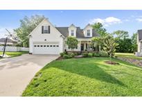 Charming two-story home with a well-manicured lawn, basketball goal, and an attached two-car garage at 45 Mill Cir, Clayton, NC 27527