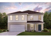Charming two-story home with an attached garage and well-manicured lawn, blending comfort and curb appeal seamlessly at 5015 Harrier Ln, Snow Camp, NC 27349