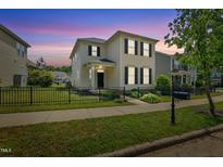 Charming two-story home with black shutters, black fence, and lush green lawn at 704 Moonbeam Dr, Raleigh, NC 27603