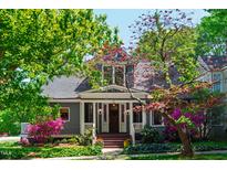 Charming home exterior with lush landscaping, a cozy porch, and a welcoming entrance at 130 N Bloodworth St, Raleigh, NC 27601
