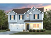 Charming two-story home boasts a manicured lawn, attached garage, and inviting front porch at 3233 Pelican Ln, Durham, NC 27703