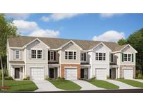 Charming townhome community showcasing craftsman-style architecture and professionally landscaped surroundings at 404 Ember St, Sanford, NC 27330