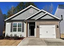 Charming single-story home with gray siding, brick accents, and an attached one-car garage at 41 Goldenrod Loop, Clayton, NC 27520