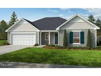 Charming one-story home featuring a two-car garage, manicured lawn, and classic architectural details at 102 Gobbler Dr, Smithfield, NC 27577