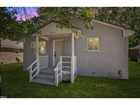 Charming single-story home featuring a cozy front porch and well-maintained lawn at 1317 Proctor St, Rocky Mount, NC 27801