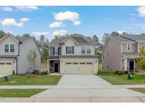 Charming two-story home with a two-car garage and well-maintained lawn at 2007 Seford Dr, Durham, NC 27703