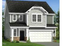 Charming two-story home featuring stone accents, a welcoming porch, and an attached two-car garage at 203 Steel Spring Rd # 21, Angier, NC 27501