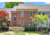 Charming brick townhome featuring well-maintained landscaping and a classic architectural design at 6000 Tenter Banks Sq, Raleigh, NC 27609