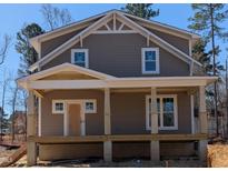 New construction craftsman-style home featuring a covered front porch with classic columns and a shingle facade at 1005 Forrestal Pl, Durham, NC 27707