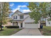 Charming two-story home with a two-car garage and a well-maintained lawn at 5609 Severn Grove Dr, Durham, NC 27703