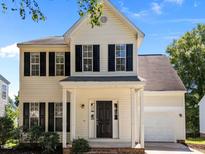 Charming two-story home with black shutters and well-maintained landscaping at 620 Hanska Way, Raleigh, NC 27610