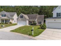 Charming home with a well-maintained lawn, complemented by an attached one car garage at 633 Prickly Pear Dr, Fuquay Varina, NC 27526