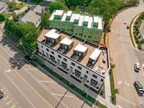 New modern townhomes with rooftop decks under construction, offering stylish city living at 1303 Chamblee Hill Ct, Raleigh, NC 27608