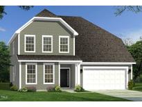 Charming two-story home with gray siding, a dark roof, a two-car garage and a well-manicured lawn at 27 Spring Crest Dr # 69, Angier, NC 27501