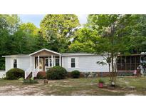 Charming single-story home with well-maintained lawn, cozy porch, and traditional curb appeal at 6237 Nc 96, Youngsville, NC 27596