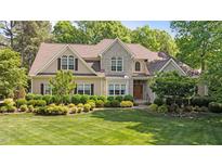 Charming two-story home with landscaped front yard and a combination of stone and siding exterior at 7212 Donneeford Rd, Wake Forest, NC 27587