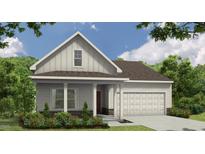 Charming exterior view of a well-maintained home with a two-car garage and inviting front porch at 121 Cribbs Ln, Middlesex, NC 27557